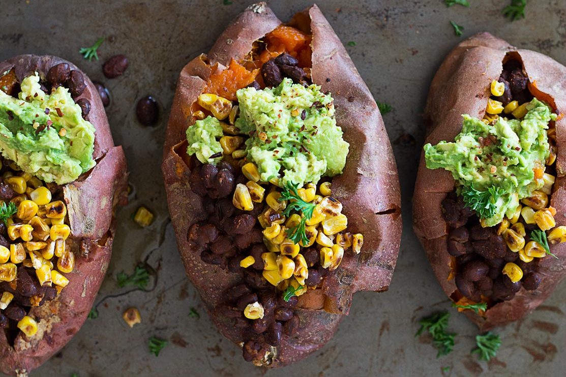 Charred Corn & Black Bean Stuffed Sweet Potatoes - the ultimate comfort food that is nourishing, wholesome, and incredibly delicious! From www.sprinkleofgreen.com