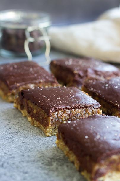 Cookie Dough Caramel Slice, also known as the most delicious dessert known to man! www.sprinkleofgreen.com #vegan #paleo #caramelslice