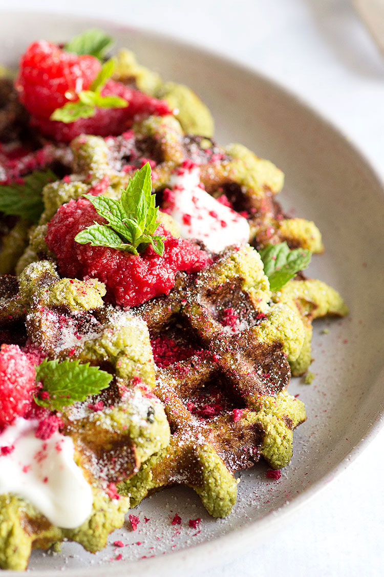 Matcha Waffles with Rasberry Coulis | Gluten free and paleo waffles that are high in protein and taste utterly delicious. The perfect post-workout meal!