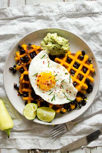 Morning Glory Savoury Sweet Potato Waffles | Gluten free waffles topped with black beans, avocado, and a fried egg | Healthy protein breakfast made simple and delicious!