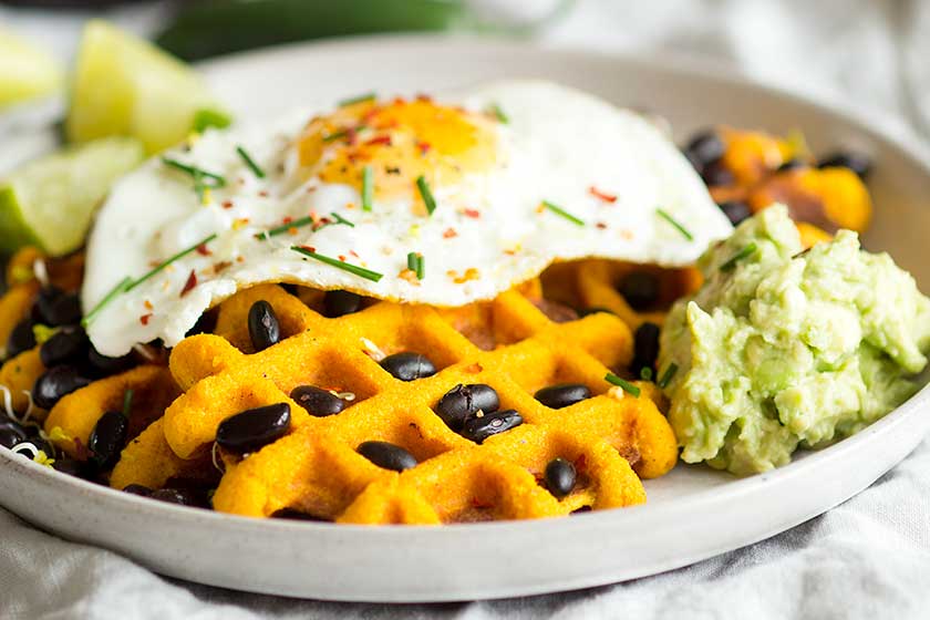 Morning Glory Savoury Sweet Potato Waffles | Gluten free waffles topped with black beans, avocado, and a fried egg | Healthy protein breakfast made simple and delicious!